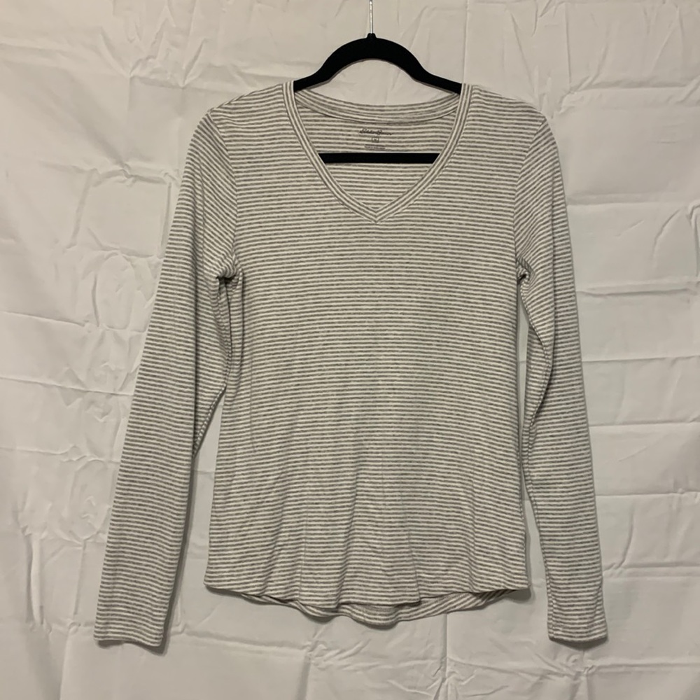 Grey and white striped long sleeve shirt.